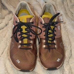 On Running Shoes with Yellow and Brown Details